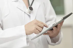 Medical Care Professional Prints: Doctor working with a tablet computer