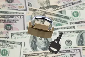 Dollar Banknotes Prints: Many dollar banknotes with a lock