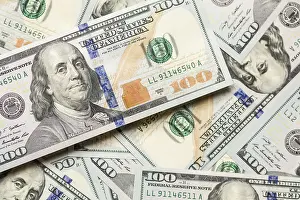 Close Up Dollar Bills Prints: One hundred dollar bills laying on flat surface