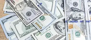 US Dollar Notes Prints: Many hundred dollar bills on the table