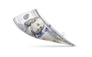 Dollar Banknote Prints: One hundred dollar bill floating down to surface with drop shadow isolated on a white background