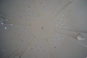 Kallithea Thermal Baths Prints: Dome-shaped ceiling with star-shaped light patterns in shades of blue inside a structure