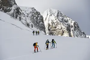Snowy Mountain Range Europe Prints: Dramatic atmosphere, Ski tourers