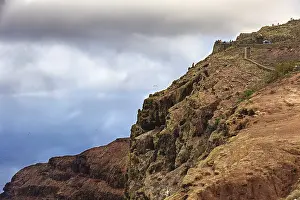 Deserted Cliff Coast Prints: Dramatic cliffs above the sea under a cloudy sky