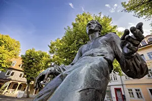 Johann Sebastian Bach Monument Prints: Dramatic close-up of a bronze statue with blue sky