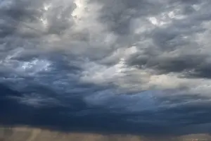 Dramatic Cloud Formation Prints: Dramatic cloud formation and veil of rain during a summer thunderstorm