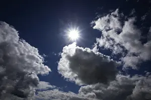 Dramatic Cloudscape Prints: Dramatic cloudscape with (cumulus) clouds and sunrays