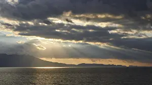 Evening Sky Greece Prints: Dramatic cloudy evening sky, sun rays breaking through clouds