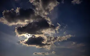 Cloudy Sky With Sun Prints: Dramatic cloudy sky with sun behind it