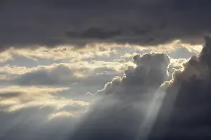 Backlit Photo Germany Prints: Dramatic cloudy sky with sun rays