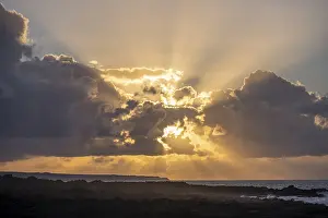 Sunset On The Coast Prints: Dramatic cloudy sky with sunbeams at sunset
