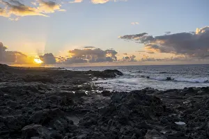 Spanish Coastal Scenery Prints: Dramatic cloudy sky with sunbeams at sunset