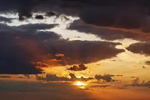 Sunset Over Baltic Sea Prints: Dramatic cloudy sky at sunset, sunbeams