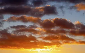 Atmospheric Evening Light Europe Prints: Dramatic evening sky with clouds at sunset