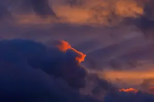 Evening Sunlight In Germany Prints: Dramatic evening sky at sunset