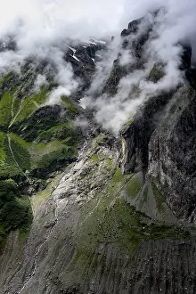 Cloudy Sky With Mountains Prints: Dramatic mountain landscape covered in clouds