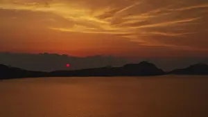 Peloponnese Landscape Photography Prints: A dramatic red sunset, the landscape appears in backlight
