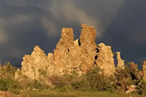 North America Nature Scenery Prints: Dramatic rock formations against a cloudy sky at dusk