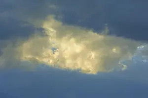 Dramatic Sky Prints: Dramatic sky with bright clouds in the sunlight shining through a gap