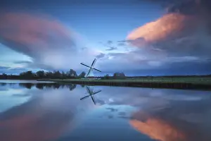 Benelux Countryside Scene Prints: Dramatic stormy sunset over Dutch windmill and river