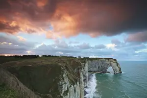 Normandy Coastal Landscape Prints: Dramatic sunrise over cliff in ocean