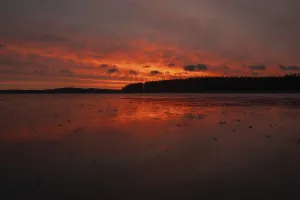 Frozen Lake Landscape Photography Prints: A dramatic sunset over a still