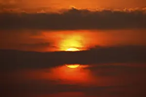 Central Europe Cloudy Skies Prints: Dramatic sunset behind clouds, Schleswig-Holstein