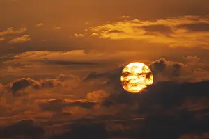 Etosha National Park Prints: Dramatic sunset with clouds and sun