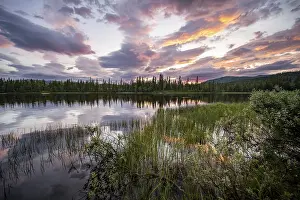Deserted Waterfront Norway Prints: Dramatic sunset by the river Namsen with reflection
