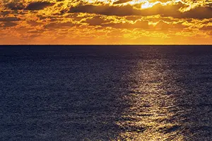Cloudy Landscape Photography Prints: Dramatic sunset at the sea, sunbeams behind clouds