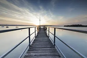 Evening Sun German Landscape Prints: A dramatic sunset seen from a pier