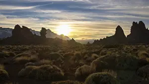 Dramatic Evening Sky Prints: Dramatic sunset with silhouetted rocks against cloudy sky