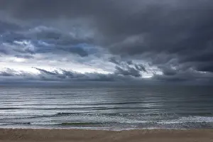 Images Dated 20th December 2024: Ocean Scene Print Under Stormy Sky