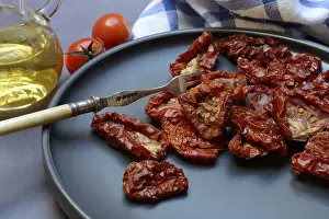 Dried Tomato Photography Prints: Dried tomatoes on plate with fork