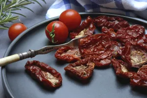 Dried Tomatoes Prints: Dried tomatoes on plate with fork