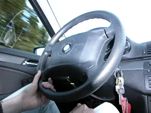Close Up Steering Wheel Prints: Driving with one hand