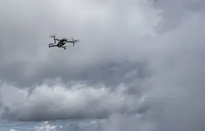 Upper Bavaria Aerial View Prints: Drone with camera flies in front of clouds