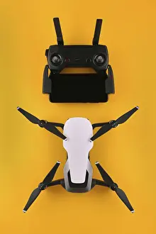 Drone Quadcopter Prints: Drone quadcopter with a remote control and a smartphone is ready to fly