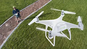 Unmanned Aerial Vehicle UAS Prints: Drone quadcopter (UAV) in air above pilot with remote controller