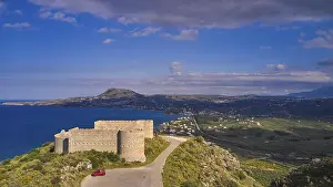 Prints of Drone shot, Drapanon peninsula, blue sky with grey-white clouds, Aptera fortress, Koule fortress, Turkish, partly restored, green meadows, Souda, Chania, West Crete, island of Crete, Greece Aerial View Prints: Drapanon Peninsula Print, West Crete, Greece