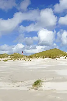 Northern German Coast Prints: Dunes with lighthouse and cloudy sky