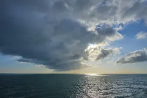 Northern Europe Dusk Scene Prints: Dusk at sea with dramatic clouds and light in the background