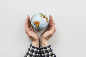 Earth Globe Prints: Earth globe surrounded by hands