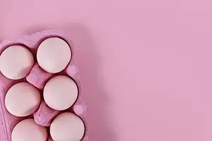 Pink Background Prints: Easter eggs in box on pink background with copy space