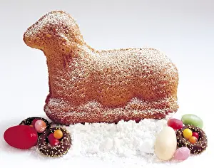Cute Easter Treats Prints: Easter lamb made of sponge cake sitting on icing sugar with Easter sweets