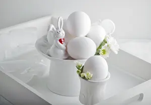 Pastel Colored Flowers Prints: Eggs, rabbit and flowers on a white surface