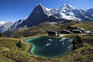 Bernese Oberland Scenery Prints: Eiger mountain reflected in an artificial lake