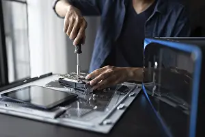 Images Dated 27th August 2024: IT Engineer Installing Hardware Print