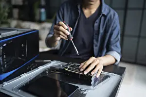 Images Dated 27th August 2024: IT Engineer Installing Hardware Equipment Print