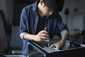 Images Dated 27th August 2024: IT Engineer Installing Motherboard Print